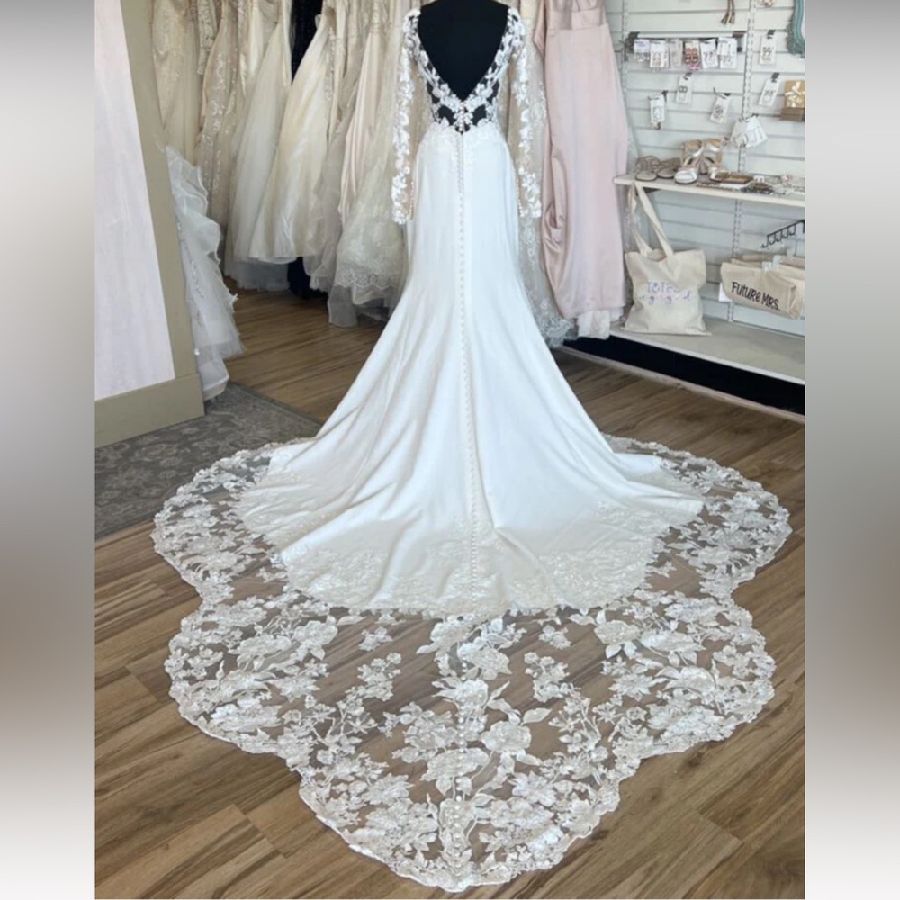 Wedding dress. Never worn by me. Purchased at a consignment bridal shop.